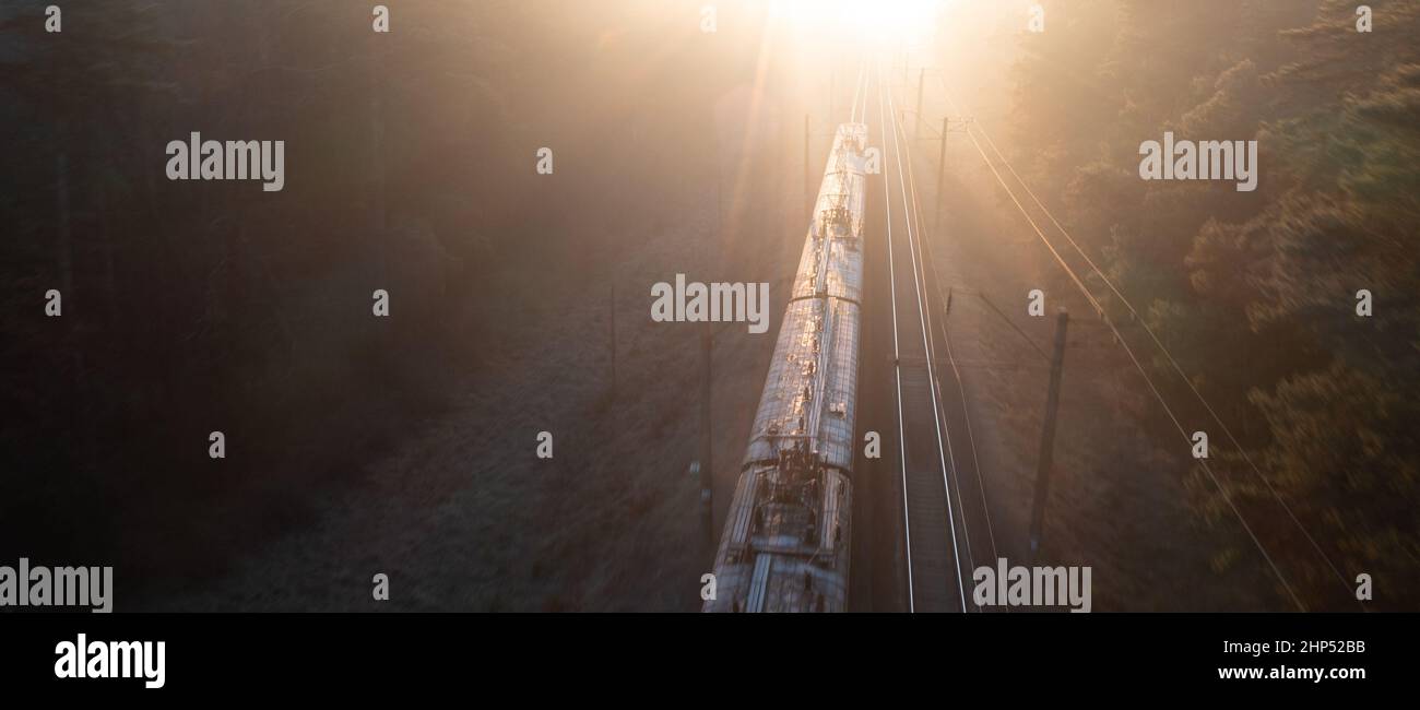 Freight train at high speed, top view, motion blur. Drone view Stock