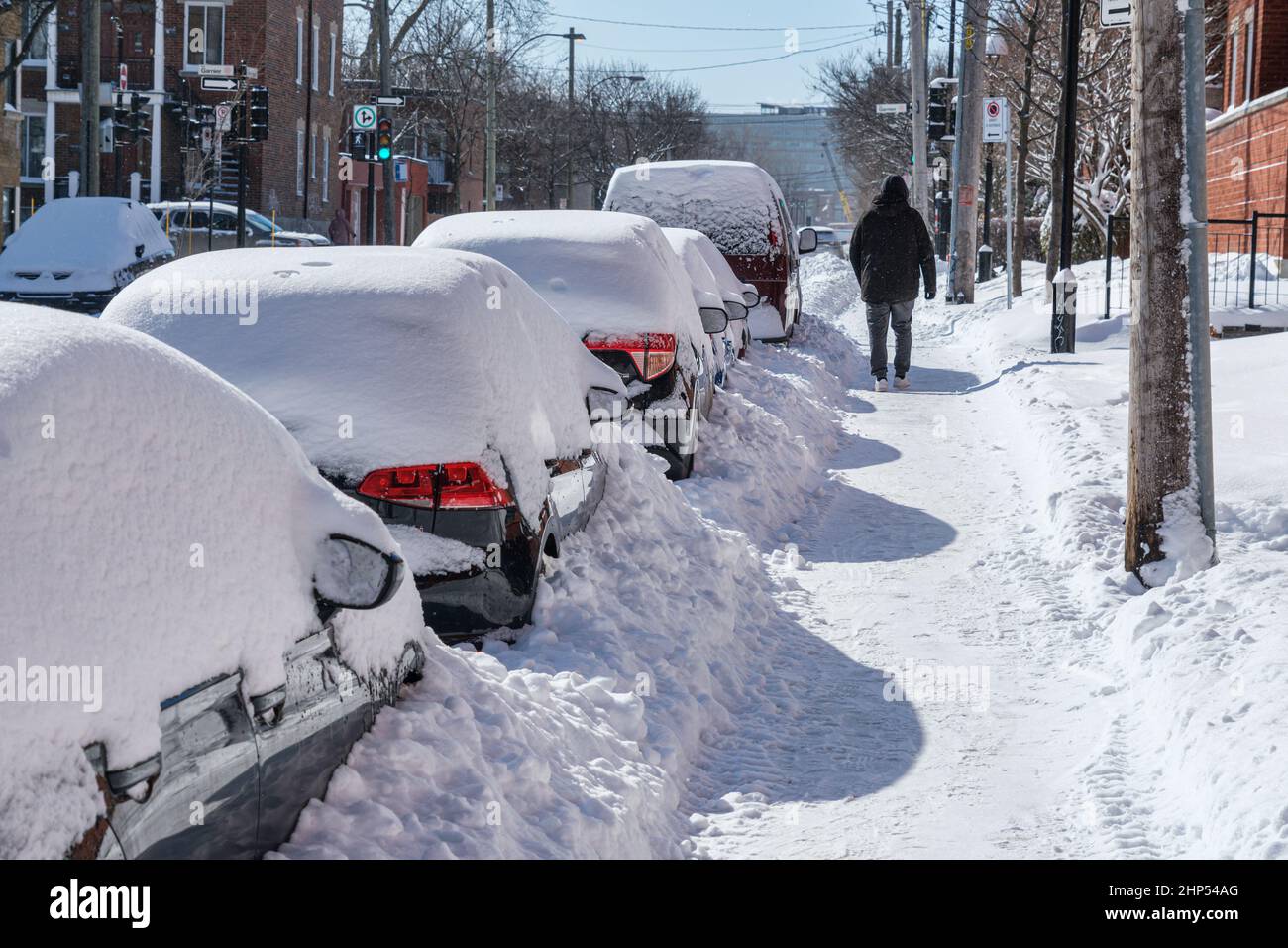 Montreal, Canada - 18 February 2022: Cars covered with snow after snow storm. Stock Photo