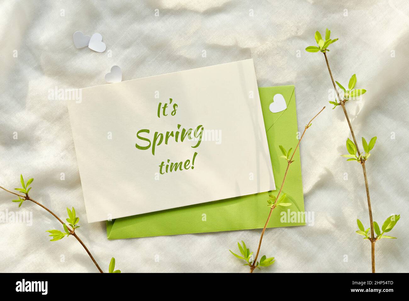 Text It's Spring time on card. Spring background with green envelope ...