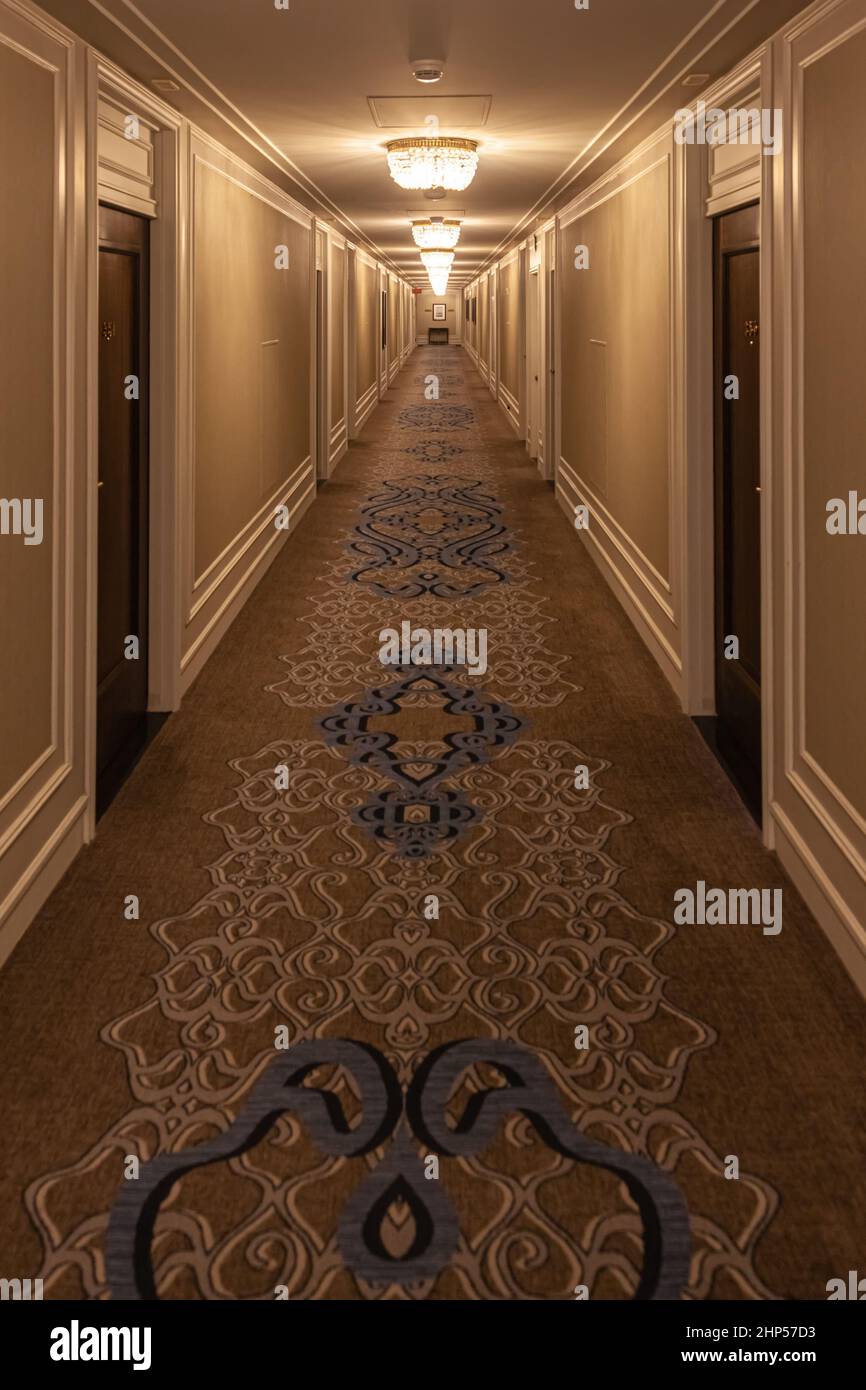 Perspective view of a long hotel corridor in Vancouver British Columbia Canada Stock Photo
