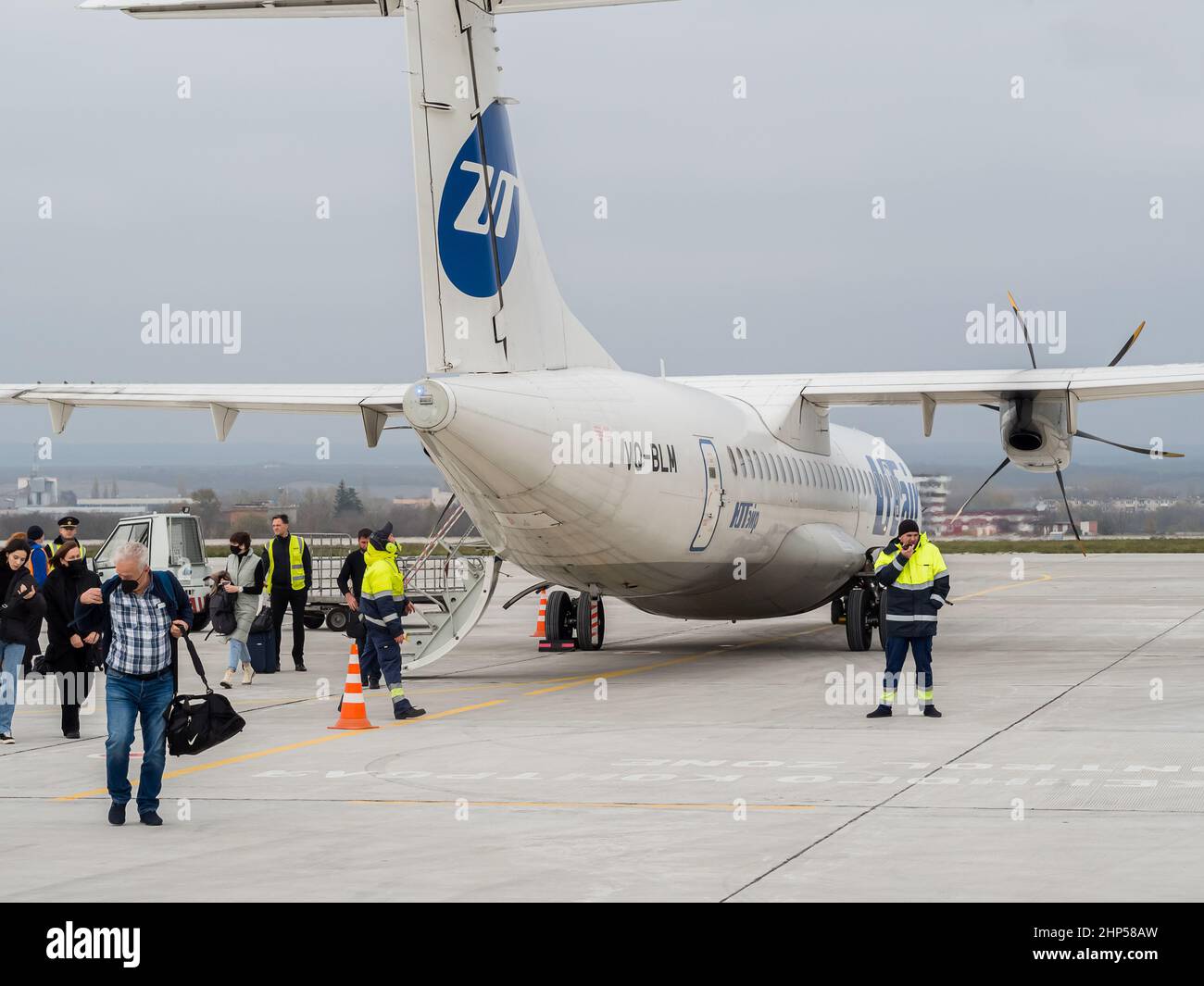 Russia, Kislovodsk 02.11.2021. A small plane that has just landed stands at the airfield and the passengers get out. Stock Photo