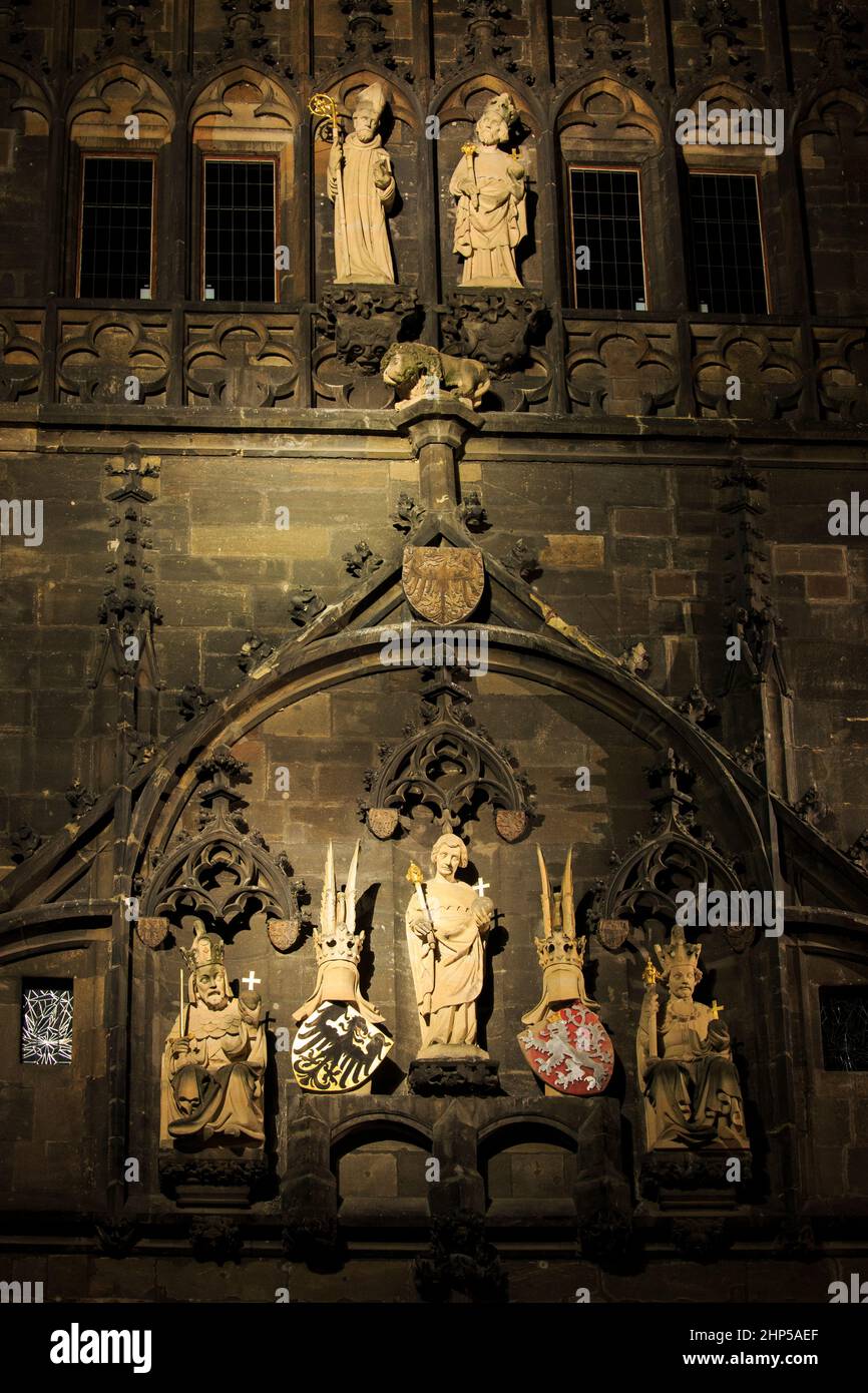 Statues on the Old Town Bridge Tower at night, showing St Vitus, King Wenceslas and Charles IV, Prague Stock Photo