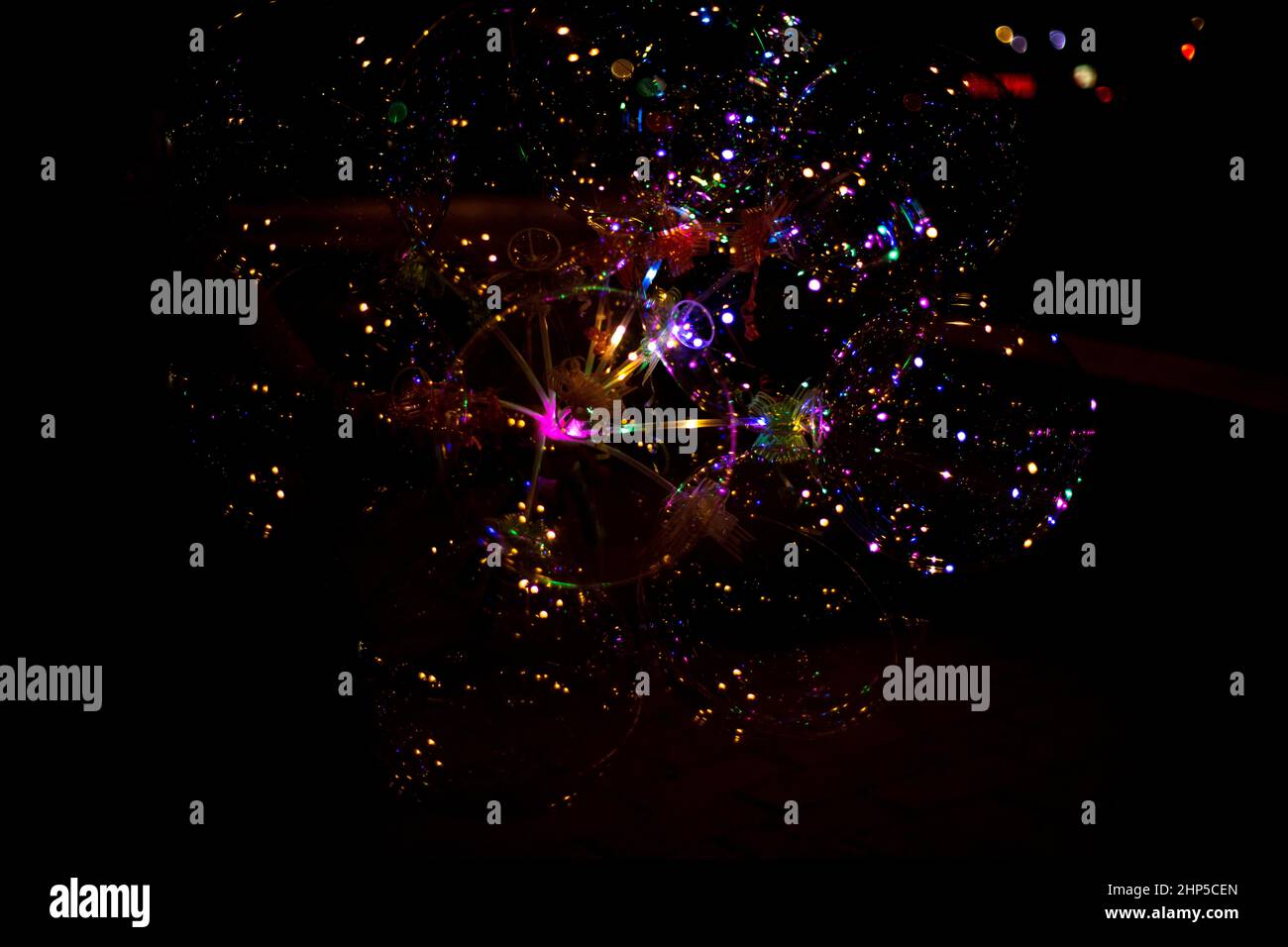 Salute in the sky. Explosion of fireworks in the night sky. Firecrackers flapping sparks in a dark space. Festive fireworks. Background with sparks fr Stock Photo