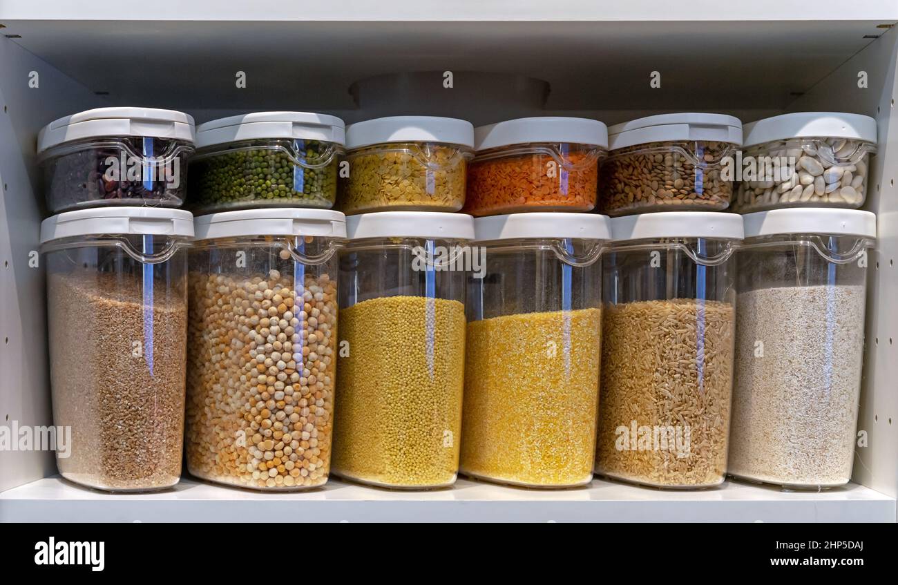 Plastic containers with various cereals and grains. Food storage