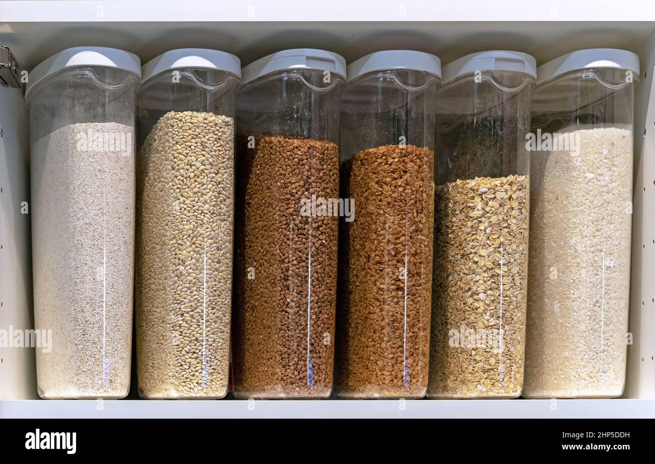 Plastic containers with various cereals and grains. Food storage