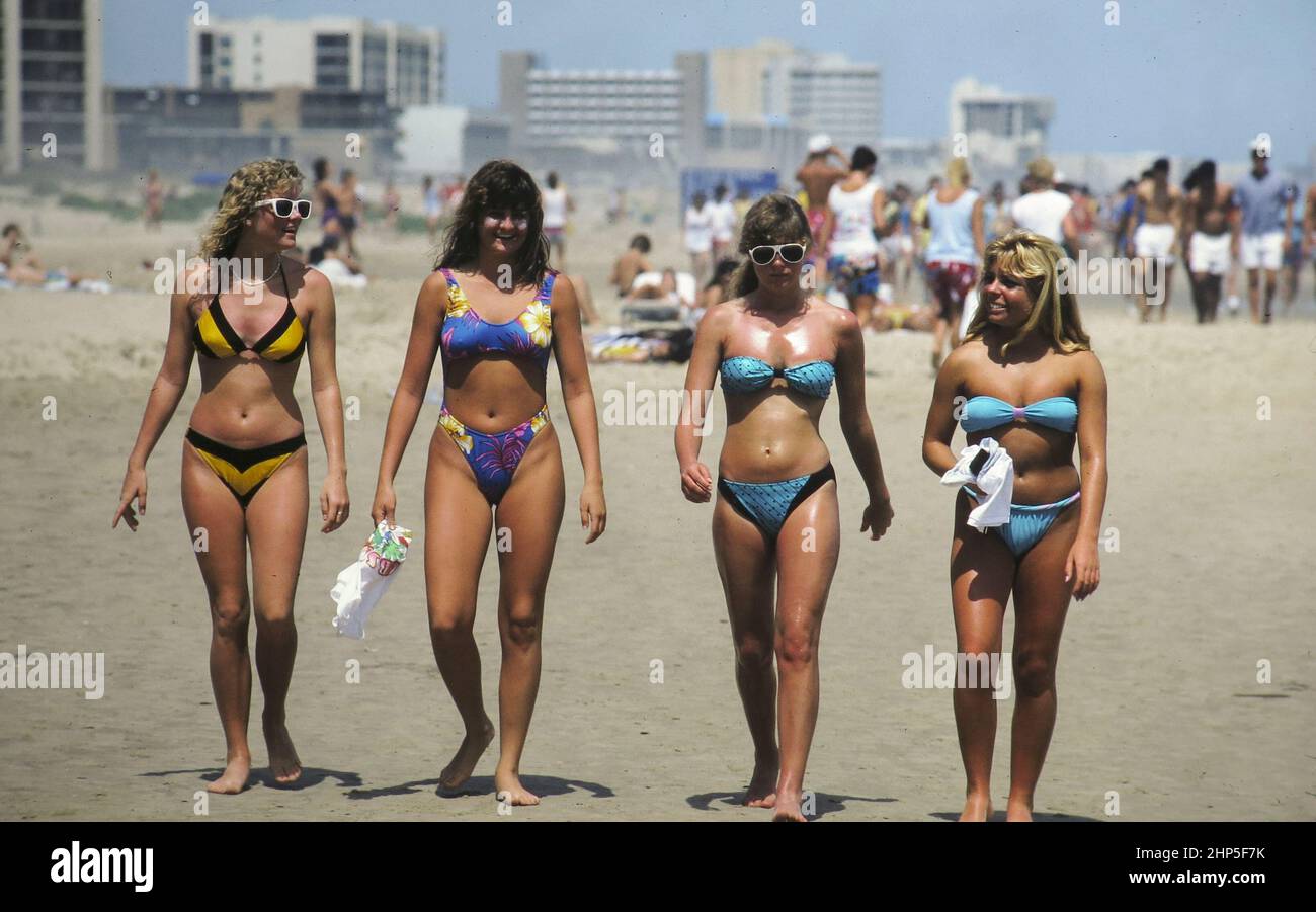 Corpus Christi, Texas USA 1993 Female college students wearing bikinis  enjoy the beach during spring break. © Bob Daemmrich Stock Photo - Alamy