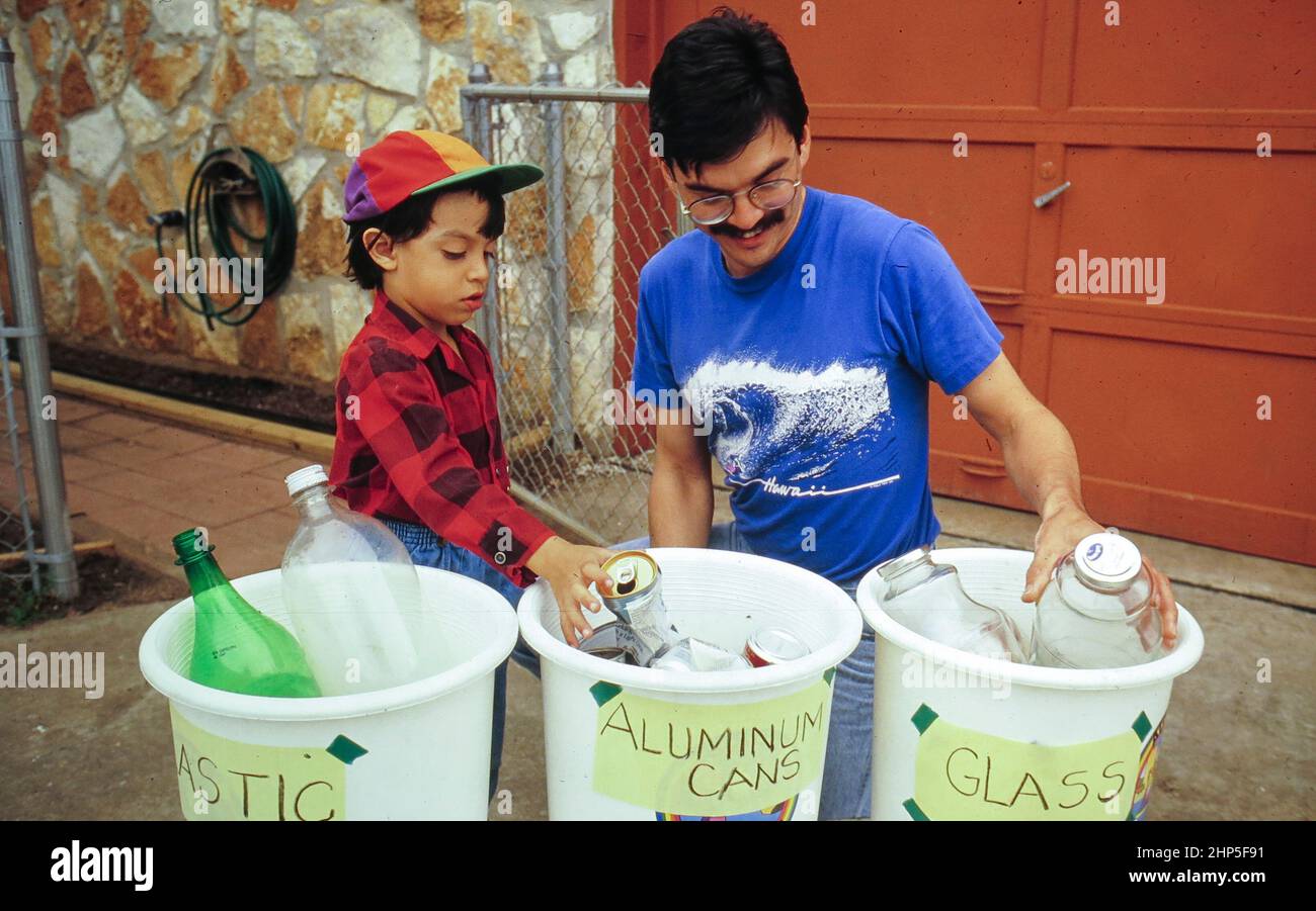 Austin Texas USA, 1990 Hispanic father and child distribute household
