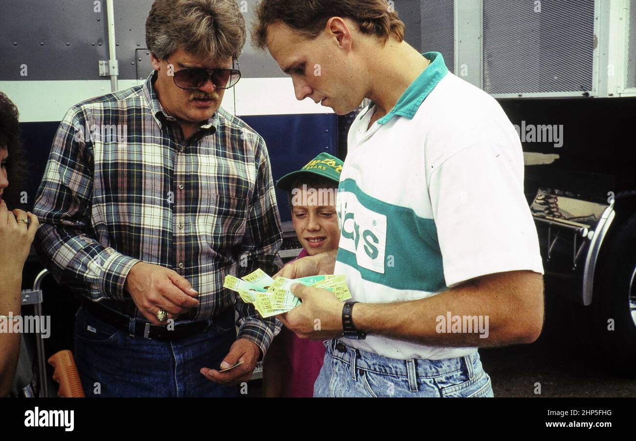 Waco Texas USA, 1994: Melling football tickets outside the stadium before a college football game. ©Bob Daemmrich Stock Photo