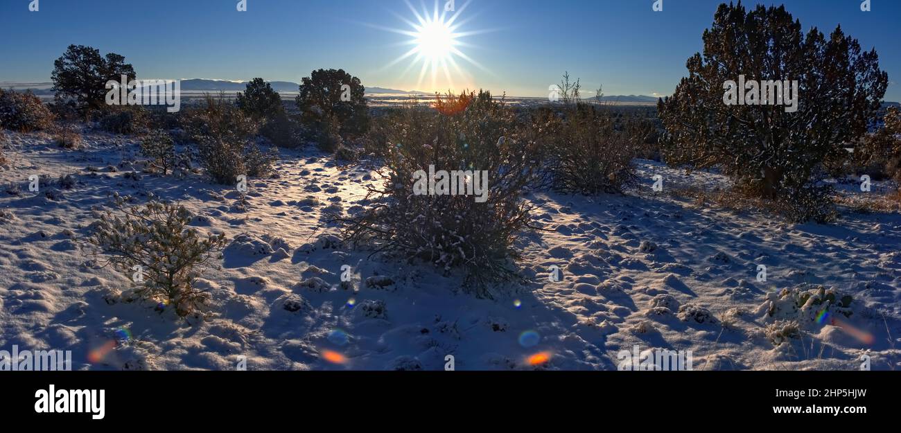 A winter morning panorama from a hill overlooking Chino Valley AZ showing fresh snowfall from a storm the night before. Stock Photo