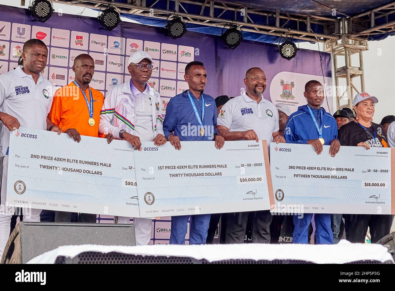 Men elite marathon winners are pictured with their medal and prize money after competing in the Access Bank Lagos City Marathon on February 12, 2022. Stock Photo