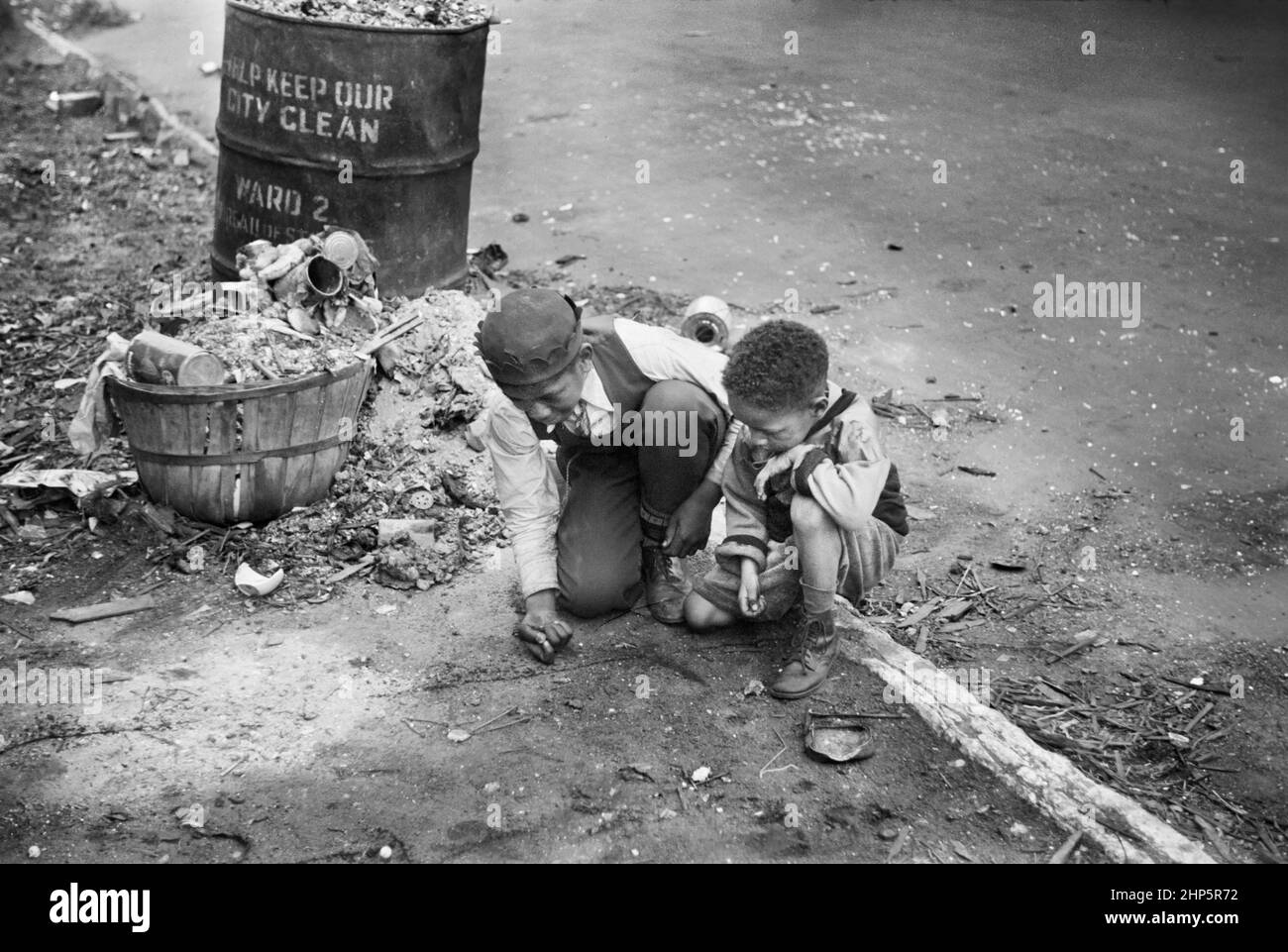 Two Boys playing on Street, Black Belt, Chicago, Illinois, USA, Edwin Rosskam, U.S. Office of War Information/U.S. Farm Security Administration, April 1941 Stock Photo