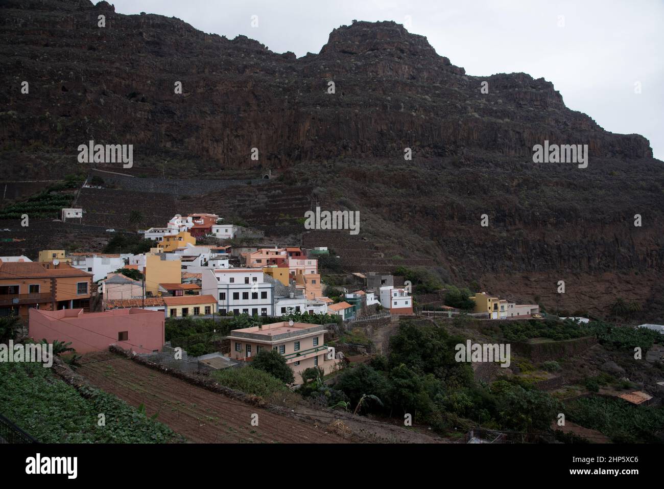 Agulo is a tiny town under very steep volcanic slopes at the north coast of La Gomera in the Canary Islands. Stock Photo