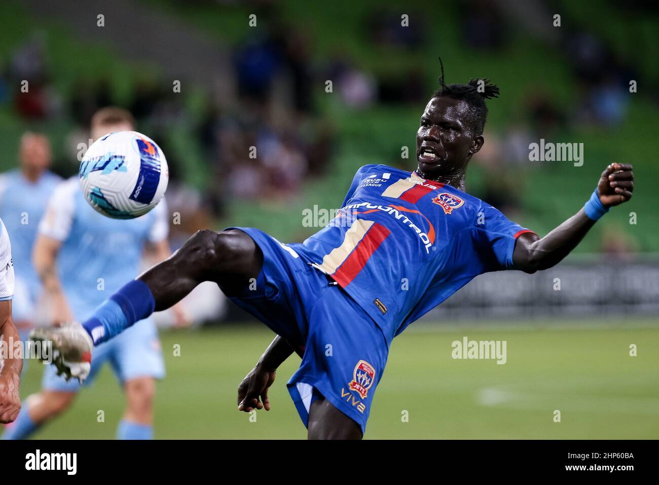 Melbourne, Australia, 18 February, 2022. Valentino Yuel of Newcastle Jets kicks the ball during the A-League soccer match between Melbourne City FC and Newcastle Jets at AAMI Park on February 18, 2022 in Melbourne, Australia. Credit: Dave Hewison/Speed Media/Alamy Live News Stock Photo