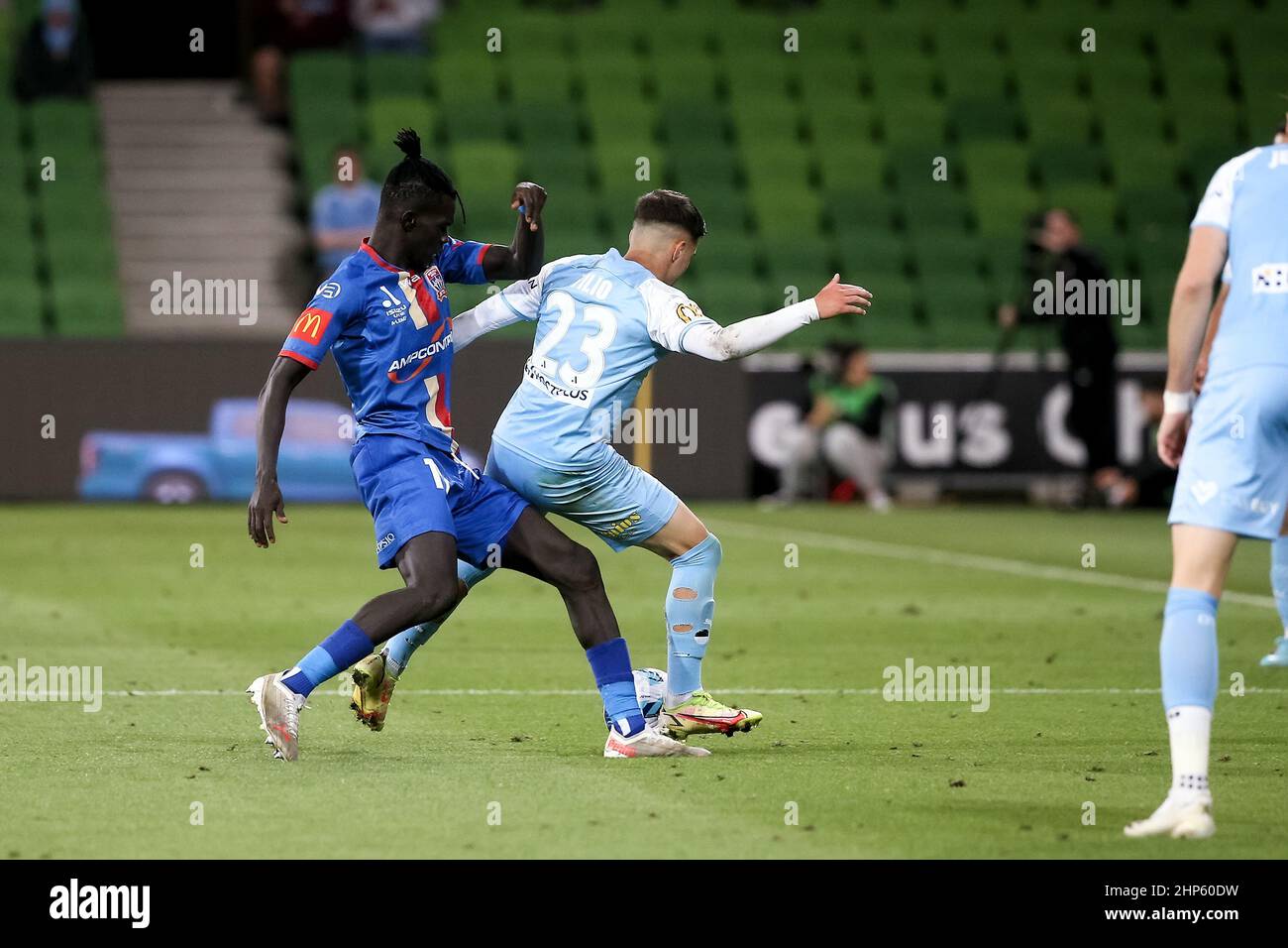 Melbourne, Australia, 18 February, 2022. Valentino Yuel of Newcastle Jets tackles Marco Tilio of Melbourne City FC during the A-League soccer match between Melbourne City FC and Newcastle Jets at AAMI Park on February 18, 2022 in Melbourne, Australia. Credit: Dave Hewison/Speed Media/Alamy Live News Stock Photo