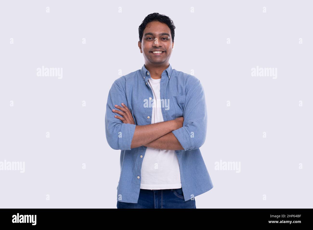 Indian Man Hands Crossed Standing Isolated Serious Face. Man Posing Stock Photo