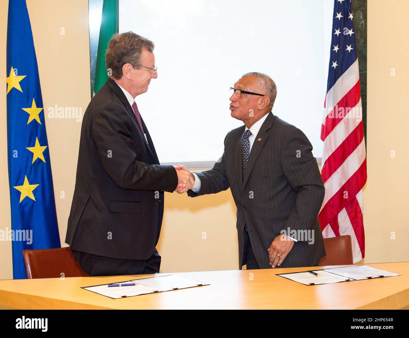 NASA Administrator Charles Bolden, right, and President of the Italian Space Agency (ASI), Professor Roberto Battiston, left, shake hands after signing a Letter of Agreement for cooperation on Earth observation research, including environmental monitoring and disaster management, on Wednesday, September 9, 2015 at the Italian Embassy in Washington, DC. Stock Photo