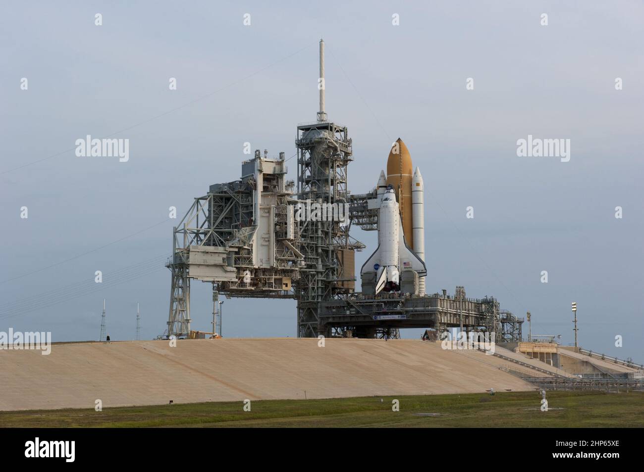 The sun rises over Launch Pad 39A and space shuttle Atlantis at NASA's ...
