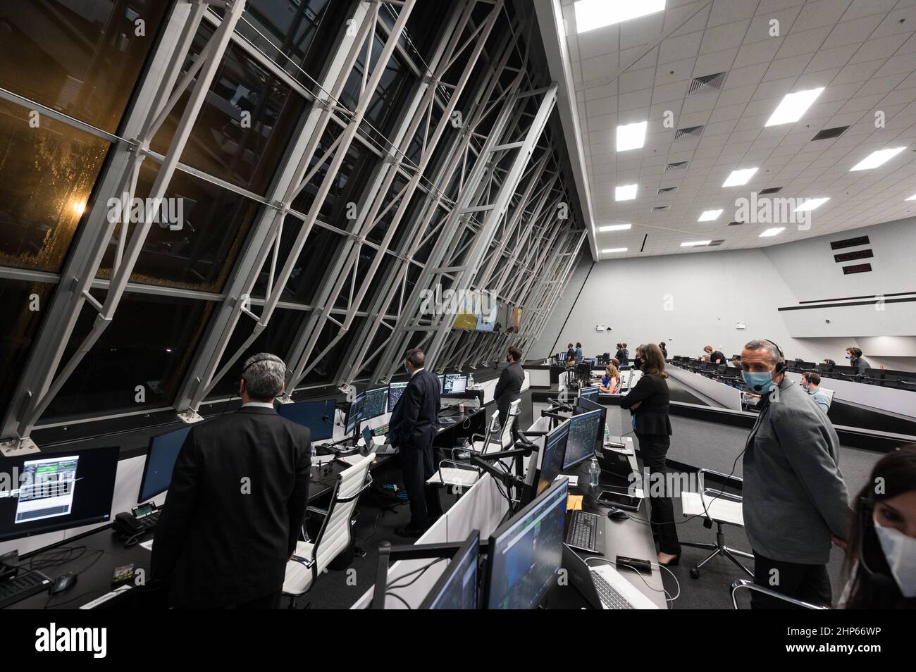 NASA and SpaceX officials monitor the launch of a SpaceX Falcon 9 rocket carrying the company's Crew Dragon spacecraft on the Crew-3 mission with NASA astronauts Raja Chari, Tom Marshburn, Kayla Barron, and ESA (European Space Agency) astronaut Matthias Maurer onboard, Wednesday, Nov. 10, 2021, in  firing room four of the Launch Control Center at NASA’s Kennedy Space Center in Florida. Stock Photo