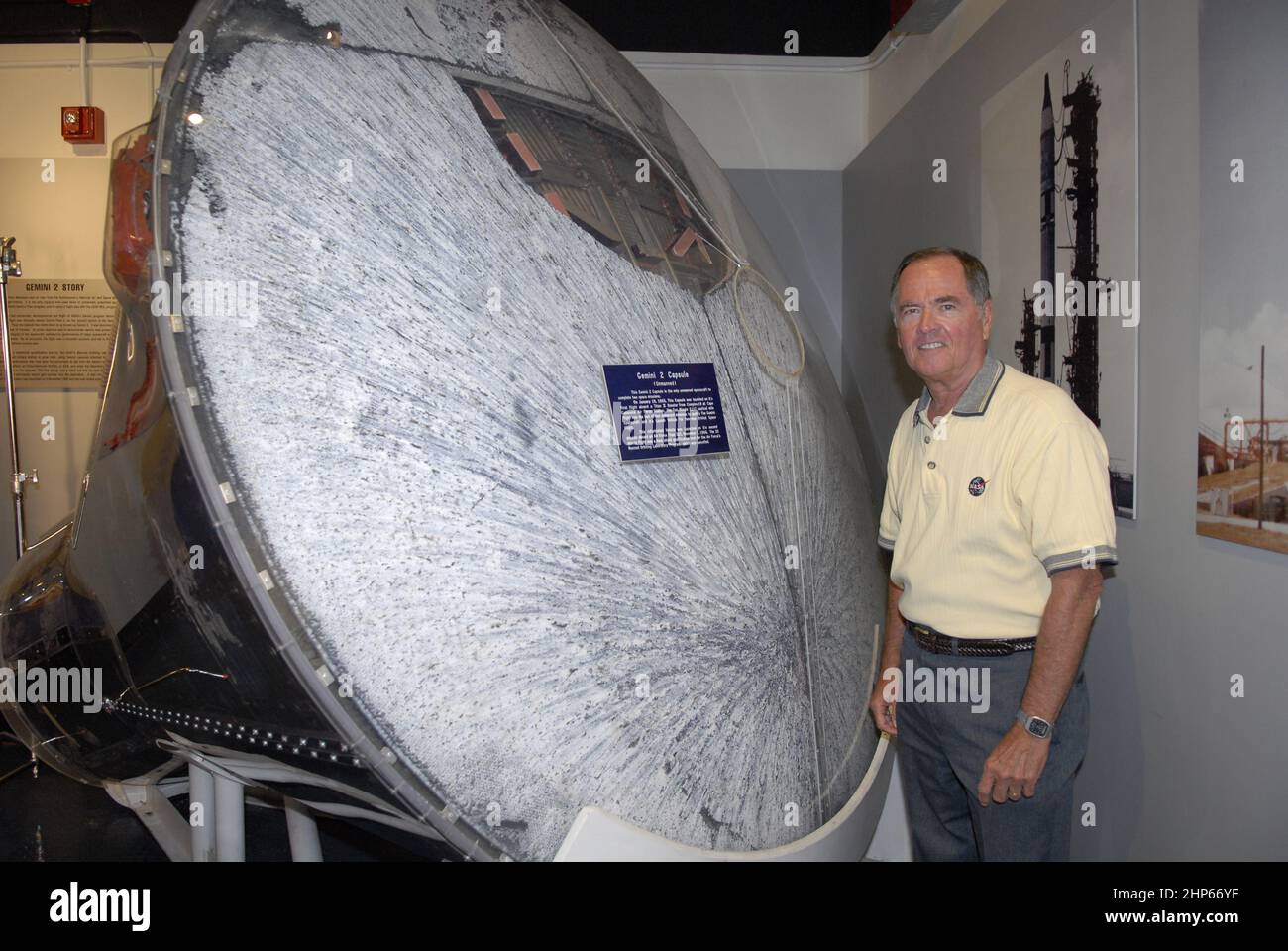 Astronaut Bob Crippen with the Gemini-B capsule that was launched as a test flight for the Manned Orbiting Laboratory. Note the hatchway cut into the heat shield. The capsule's heat shield passed its flight test ca. 2007 Stock Photo