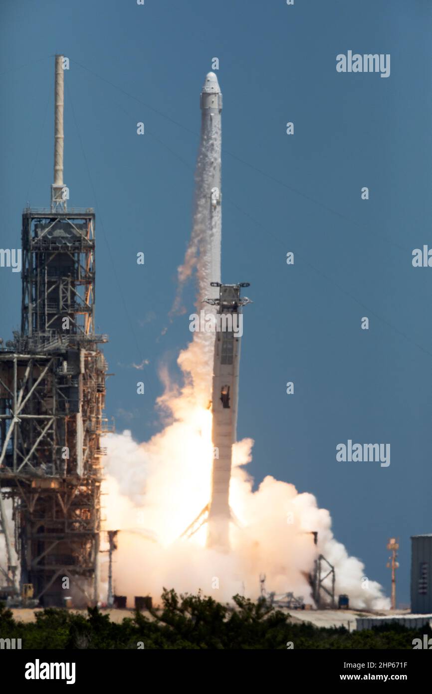 The two-stage Falcon 9 launch vehicle lifts off Launch Complex 39A at NASA's Kenney Space Center carrying the Dragon resupply spacecraft to the International Space Station ca. 2017 Stock Photo