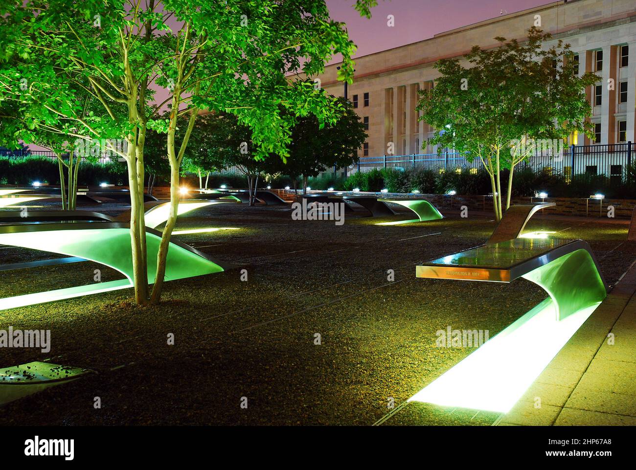 Memorial benches are illuminated at the 9/11 Memorial at the Pentagon Stock Photo