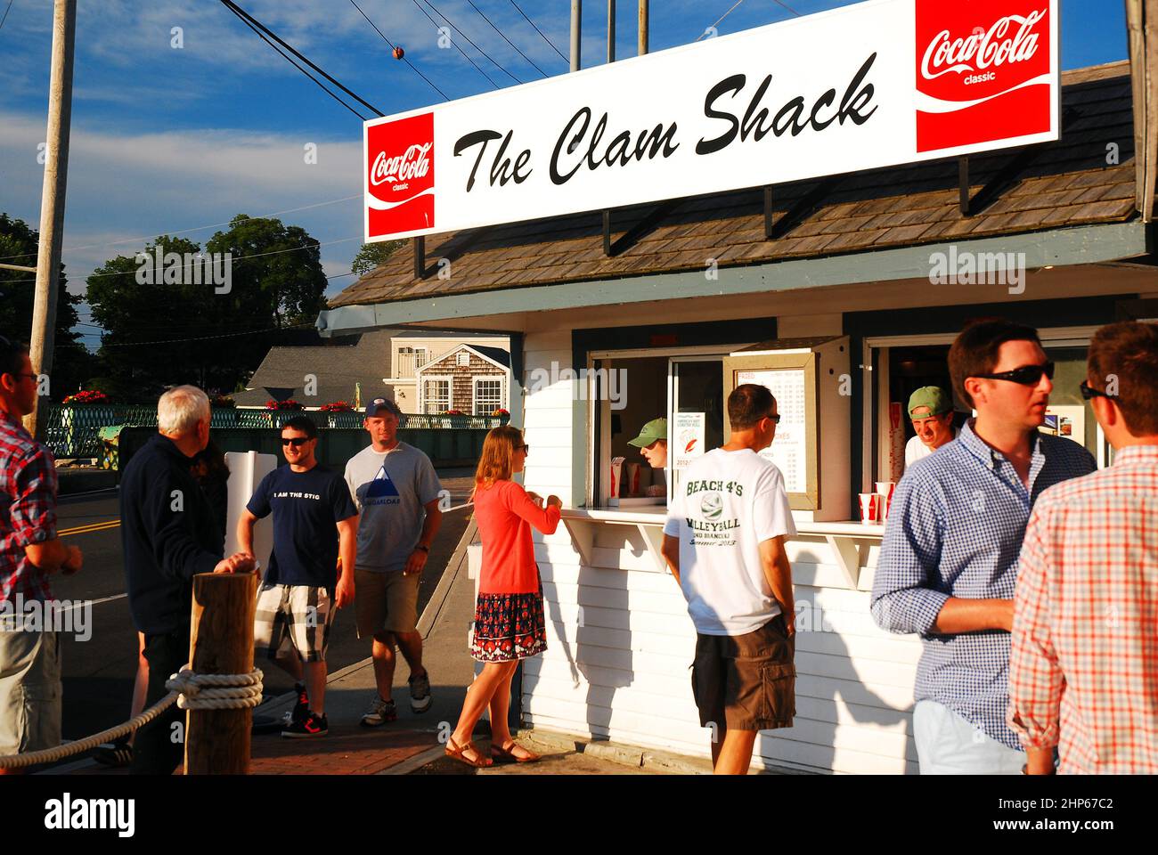 Vacationer line up at a clam shack on the river in Kennebunkport, Maine Stock Photo