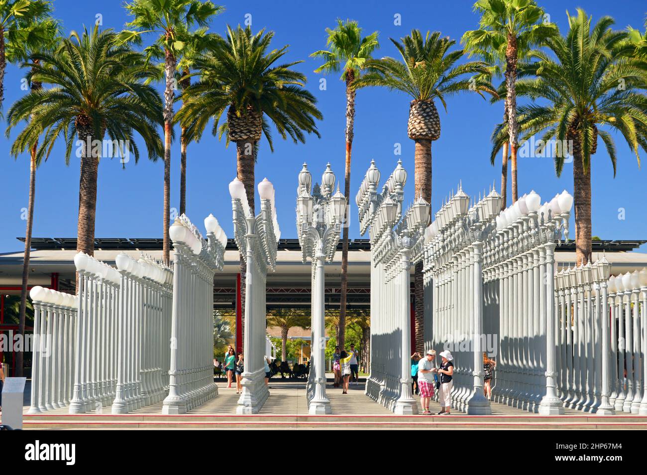 A pattern of street lights stand at the entrance of the Los Angeles