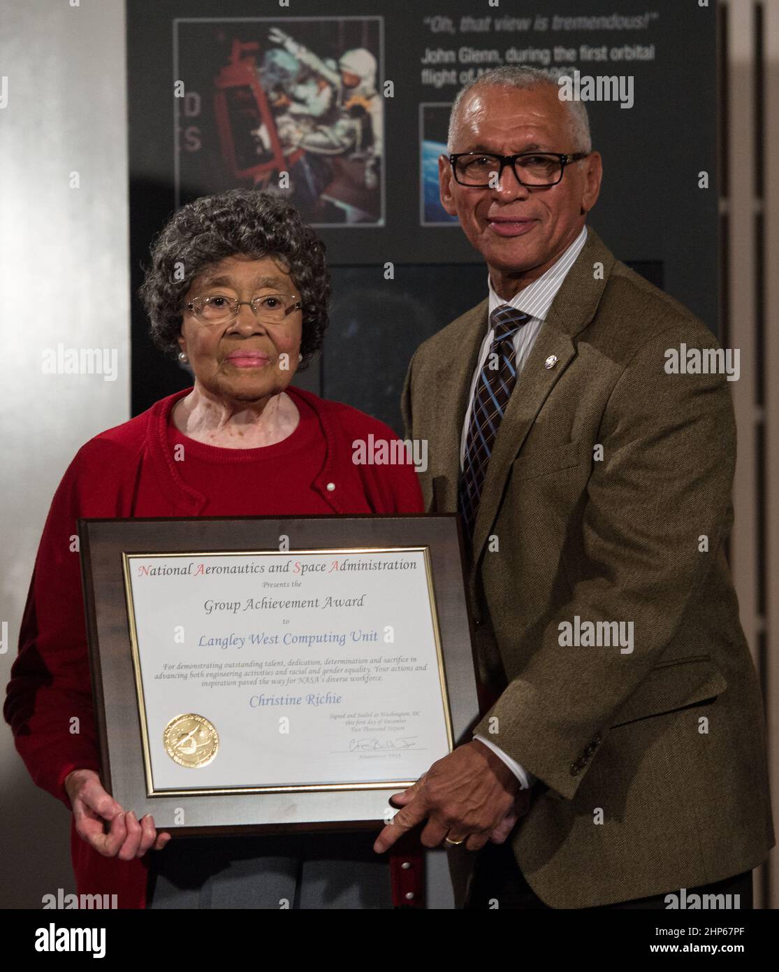 NASA Administrator Charles Bolden presents an award to NASA 'human computer' Christine Richie, at a reception to honor NASA's 'human computers' on Thursday, Dec. 1, 2016, at the Virginia Air and Space Center in Hampton, VA. Afterward, the guests attended a premiere of 'Hidden Figures' a film which stars Taraji P. Henson as Katherine Johnson, the African American mathematician, physicist, and space scientist, who calculated flight trajectories for John Glenn's first orbital flight in 1962. Stock Photo
