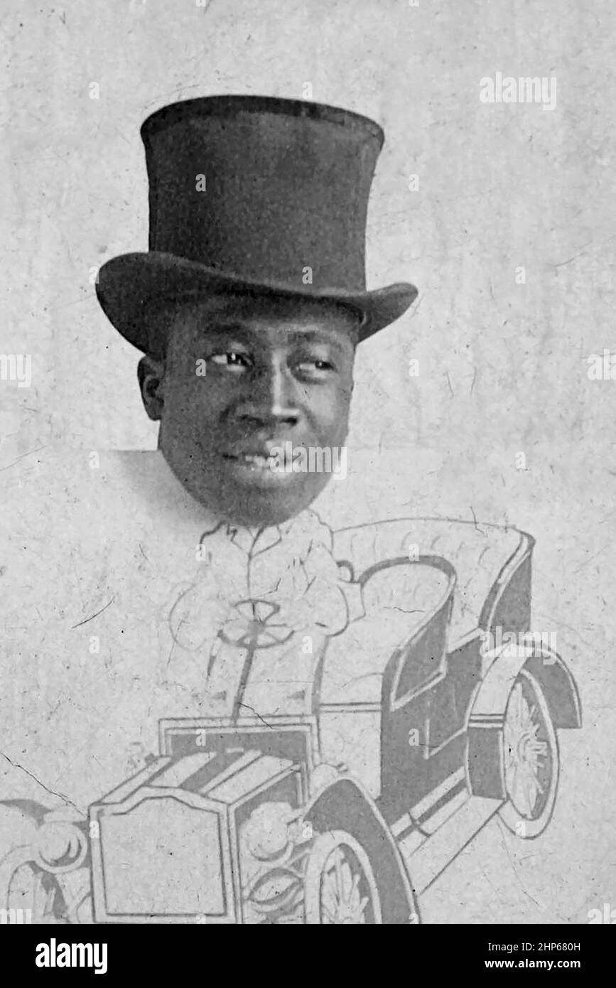 A caricature of an African American man drives an early automobile in an illustration, ca. 1910. Stock Photo