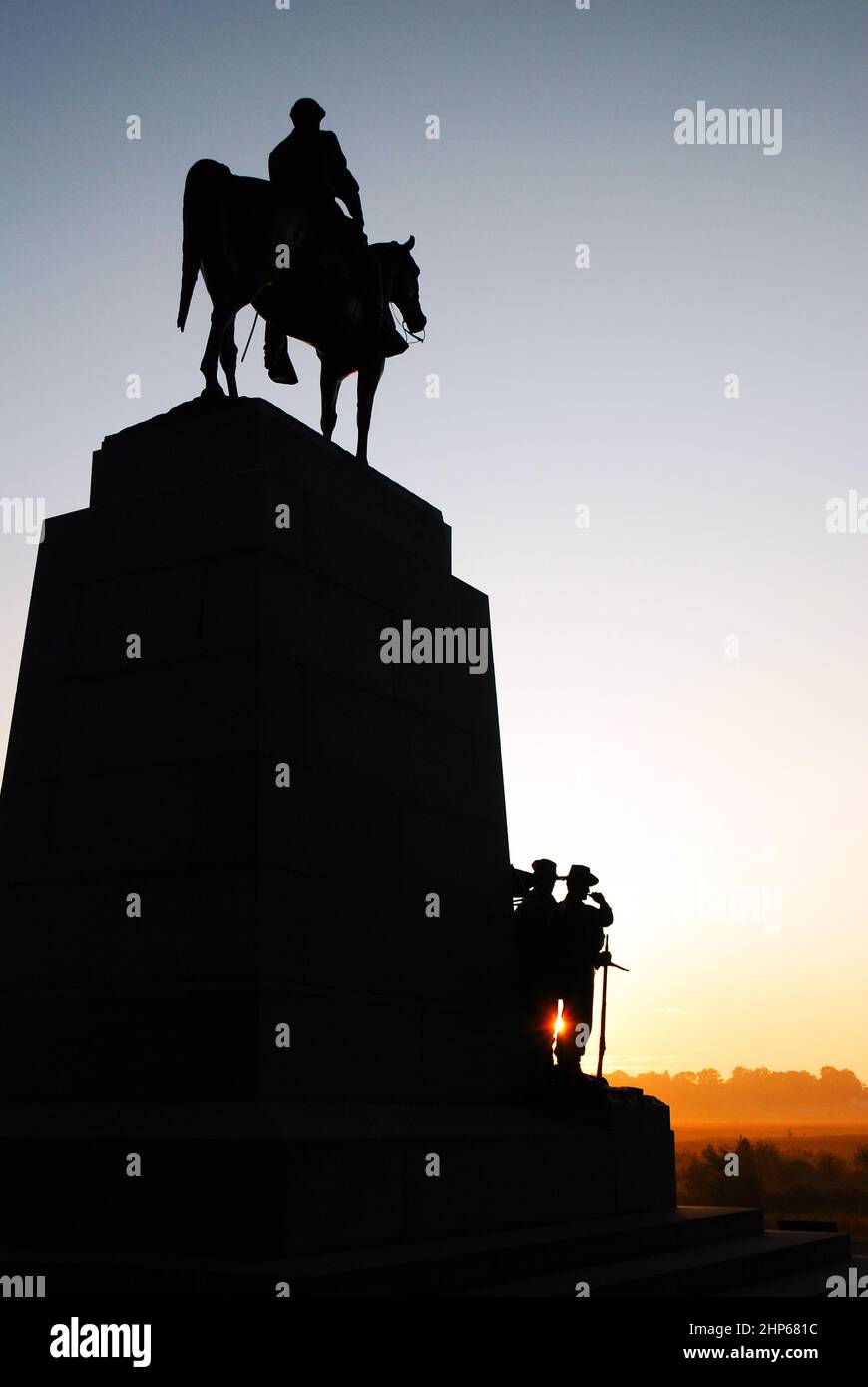 The sun rises behind the Virginia memorial at Gettysburg National Battlefield Stock Photo