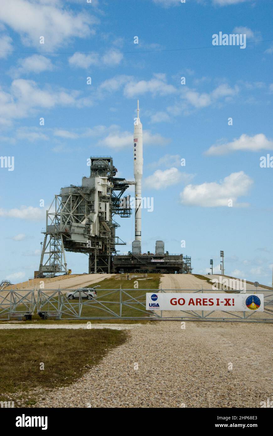 Go Ares I-X! A banner on the perimeter fence of Launch Pad 39B at NASA's Kennedy Space Center in Florida reflects the excitement building in Kennedy's work force in anticipation of the flight test of the towering 327-foot-tall Ares I-X rocket ca. 2009 Stock Photo