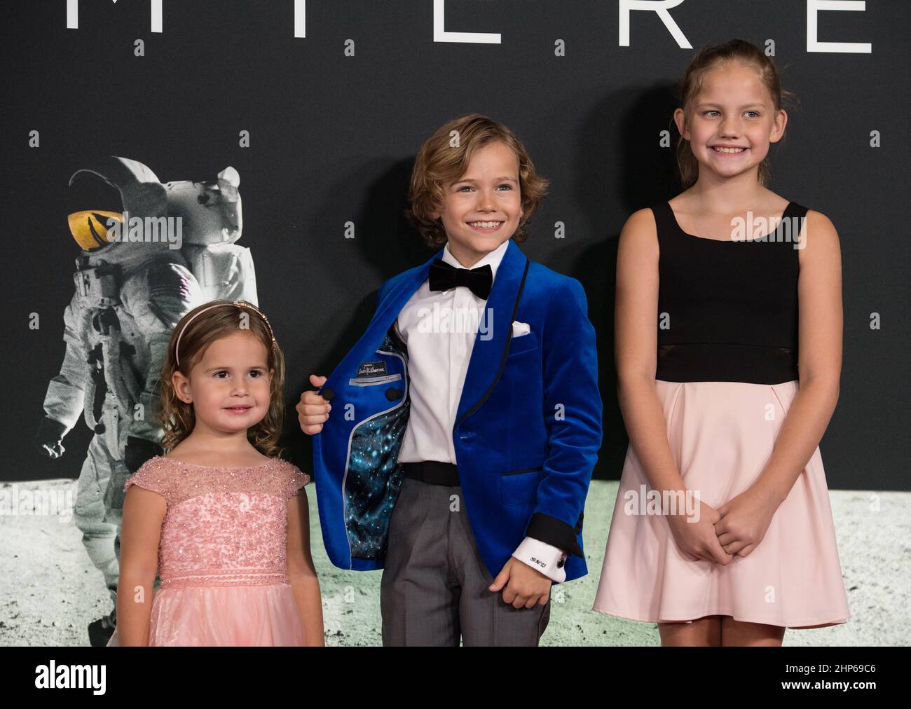 From left to right, American actress Lucy Brooke Stafford, American actor Gavin Warren, and American actress Claire Smith arrive on the red carpet for the premiere of the film 'First Man' at the Smithsonian National Air and Space Museum Thursday, Oct. 4, 2018 in Washington. The film is based on the book by Jim Hansen, and chronicles the life of NASA astronaut Neil Armstrong from test pilot to his historic Moon landing. Stock Photo