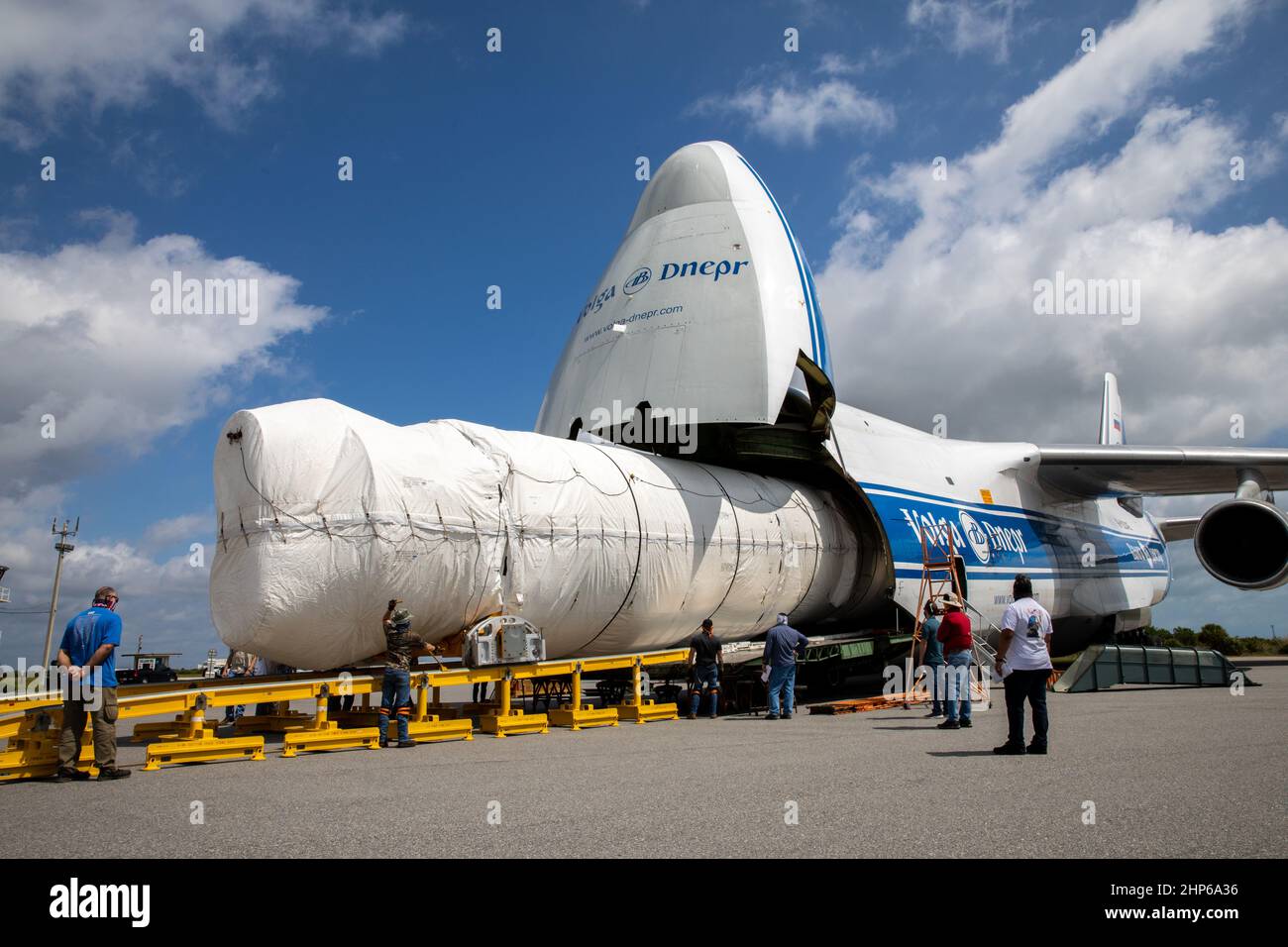 The United Launch Alliance booster for NASA’s Mars Perseverance rover is offloaded from the Antonov 124 cargo aircraft at the Skid Strip at Cape Canaveral Air Force Station (CCAFS) in Florida on May 19, 2020. The Mars Perseverance rover is scheduled to launch in mid-July atop a United Launch Alliance Atlas V 541 rocket from Pad 41 at CCAFS. The rover is part of NASA’s Mars Exploration Program, a long-term effort of robotic exploration of the Red Planet. The rover will search for habitable conditions in the ancient past and signs of past microbial life on Mars. The Launch Services Program at Ke Stock Photo