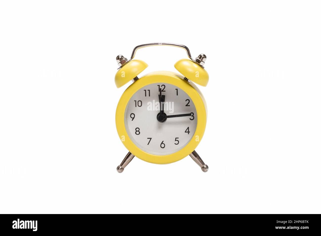 Yellow alarm clock isolated on a white background Stock Photo - Alamy