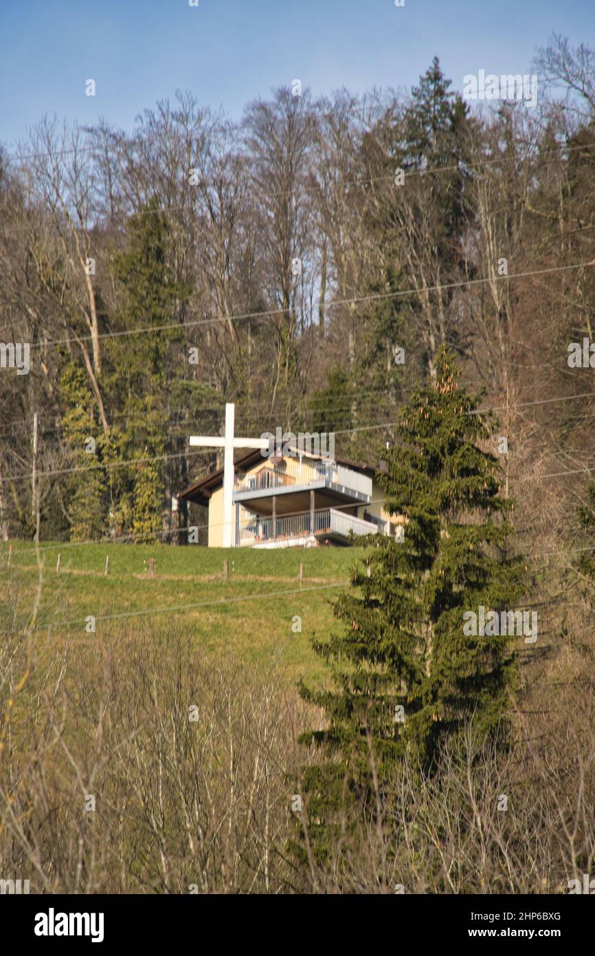Vertical shot of a church in the forest in Malters, Switzerland Stock Photo