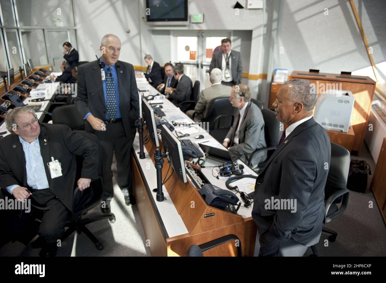 NASA Administrator Charlie Bolden, right, monitors the countdown to liftoff of space shuttle Endeavour in Firing Room 4 of the Launch Control Center at NASA's Kennedy Space Center in Florida ca. 2011 Stock Photo