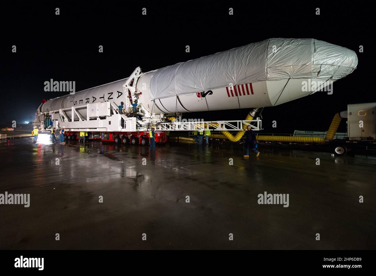 The Orbital Sciences Corporation Antares rocket, with the Cygnus spacecraft onboard, is rolled out of the Horizontal Integration Facility (HIF) to make the approximately half-mile journey to launch Pad-0A, Thursday, July 10, 2014, at NASA's Wallops Flight Facility in Virginia. Stock Photo