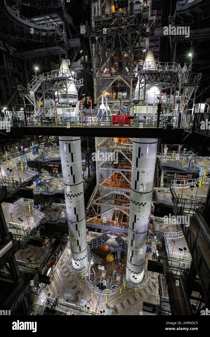 The fully stacked twin solid rocket boosters for NASA’s Space Launch System (SLS) rocket are seen on top of the mobile launcher inside High Bay 3 of the Vehicle Assembly Building (VAB) at the agency’s Kennedy Space Center in Florida on June 9, 2021. Now that booster stacking is complete inside the VAB, teams with NASA’s Exploration Ground Systems and contractor Jacobs are preparing to integrate the boosters with largest part of the SLS rocket, the massive 212-foot core stage, which arrived at Kennedy in April 2020. Stock Photo