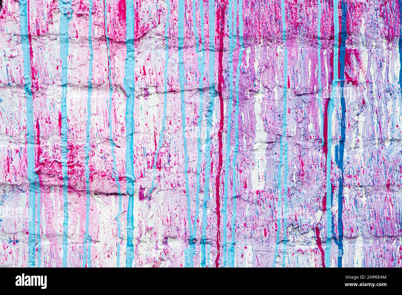 Blue and red paint drips on a white wall abstract grunge color background texture Stock Photo
