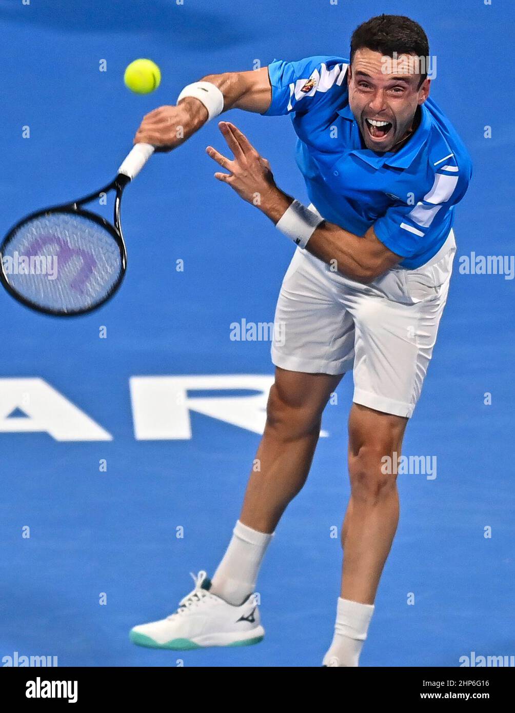 Doha, Qatar. 18th Feb, 2022. Roberto Bautista Agut of Spain serves during  the semifinal of ATP Qatar Open tennis match against Karen Khachanov of  Russia at Khalifa International Tennis Complex in Doha,