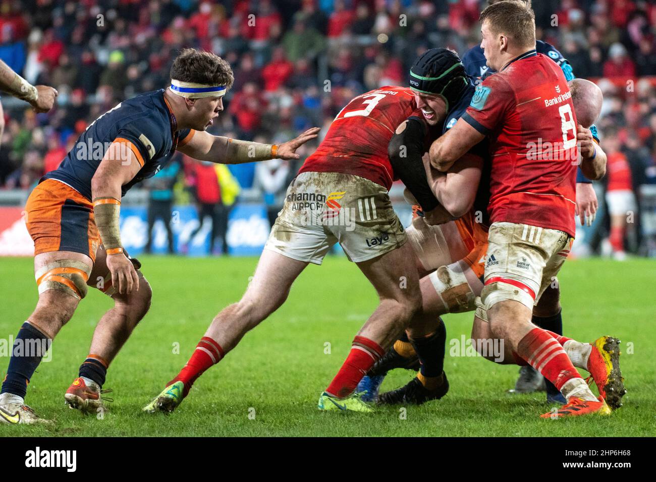 Limerick, Ireland. 18th Feb, 2022. Chris Farrell of Munster tackled by Pierce Phillips of Edinburgh during the United Rugby Championship Round 12 match between Munster Rugby and Edinburgh Rugby at Thomond Park in Limerick, Ireland on February 18, 2022 (Photo by Andrew Surma/ Credit: Sipa USA/Alamy Live News Stock Photo