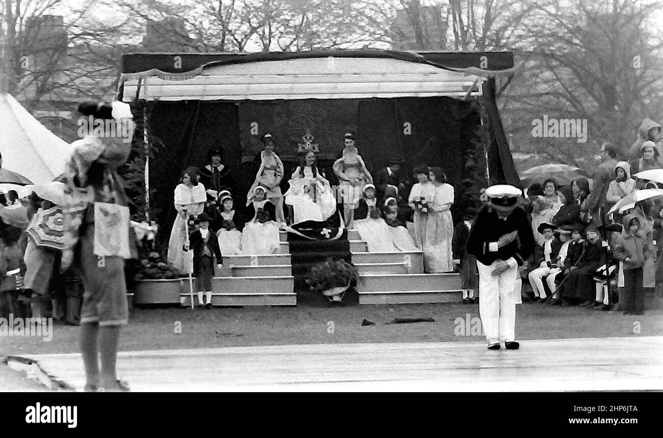 The annual Knutsford Royal May Day procession in 1976 in Knutsford, Cheshire, England, United Kingdom. It traditionally includes a fancy-dress pageant of children in historical or legendary costumes with  horse-drawn carriages. Ceremony of crowning of the girl chosen as May Queen. Stock Photo