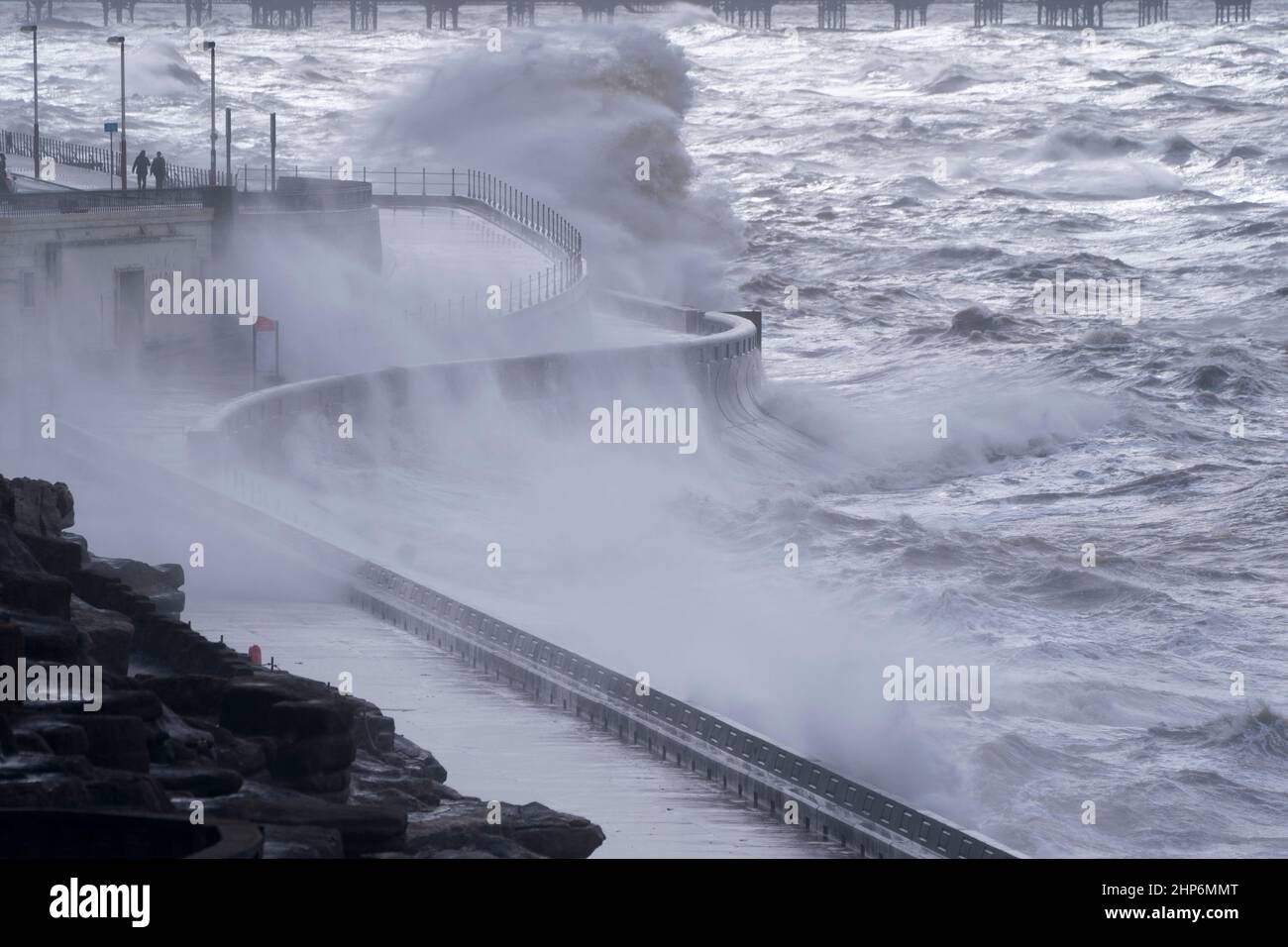 (220219) -- BLACKPOOL, Feb. 19, 2022 (Xinhua) -- Photo taken on Feb. 18, 2022 shows waves crashing onto the seafront during the high winds of Storm Eunice in Blackpool, Britain. Seen as one of the worst storms in three decades, Eunice has brought record high wind to Britain Friday, killing three people while causing massive power cuts, flight cancellations and school closures across the country. A woman in her 30s in north London was killed when a tree fell onto her car, a man in his 20s died when his truck collided with a fallen tree in southern England, and a man in his 50s in northwestern Stock Photo