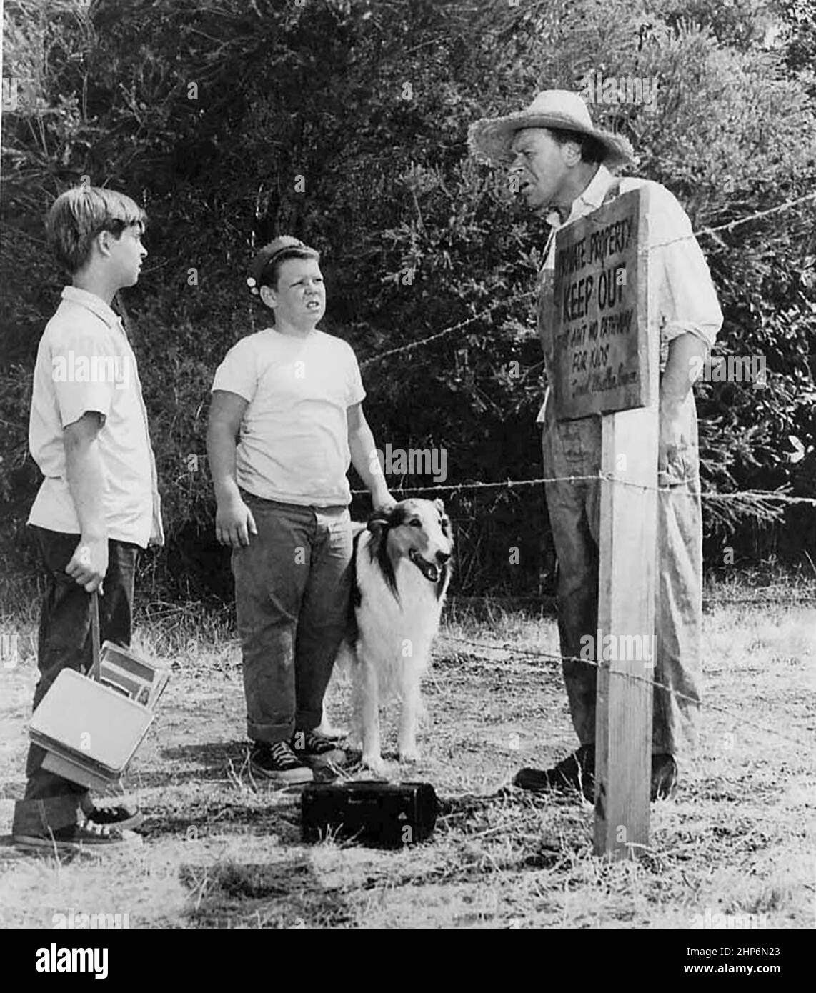 Scene from the television program Lassie. Jeff (Tommy Rettig, left) and Porky (Donald Keeler - Real name is Joey D. Vieira) are told by a land owner (Otto Waldis) to keep off his property. 7 September 1956 Stock Photo