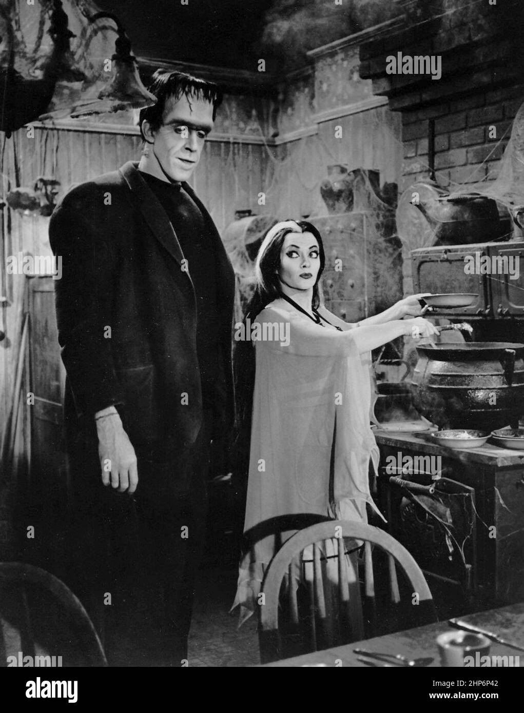 Photo of Fred Gwynne (Herman Munster) and Yvonne DeCarlo as his wife, Lily, from the television program The Munsters. Stock Photo
