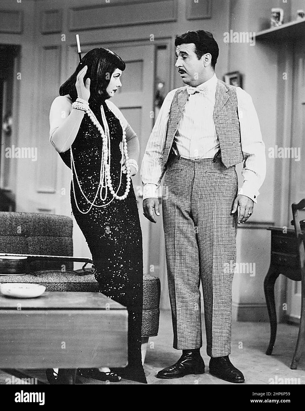 Photo of Lucille Ball as Lucy Ricardo and Tennessee Ernie Ford as 'Cousin Ernie' from I Love Lucy ca. 1954 Stock Photo