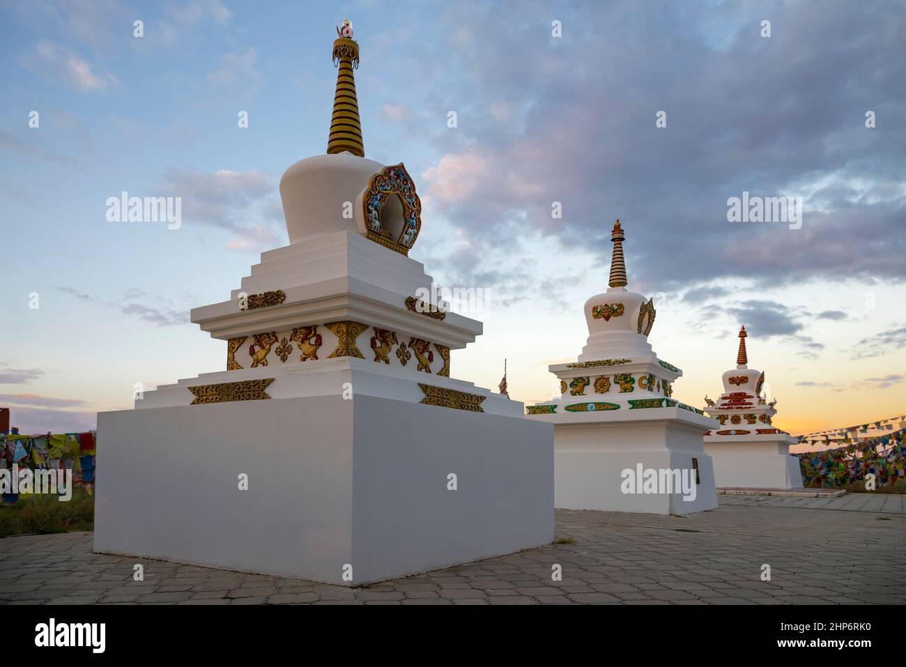 Old stupas in the Buddhist temple of Syakyusn-syume against the background of a September sunset. Elista. Republic of Kalmykia Stock Photo