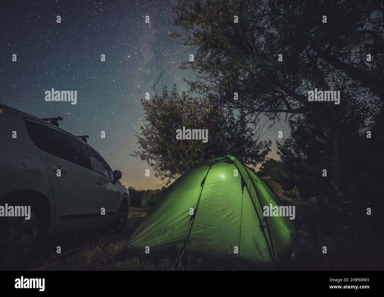 Camping with car and tent under the starry sky Stock Photo - Alamy