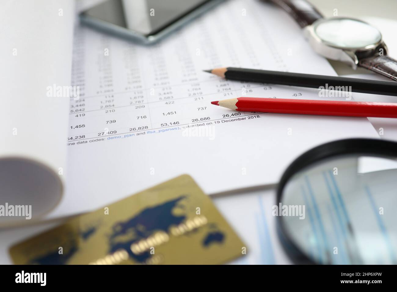 Financial documents and a credit card are on table Stock Photo