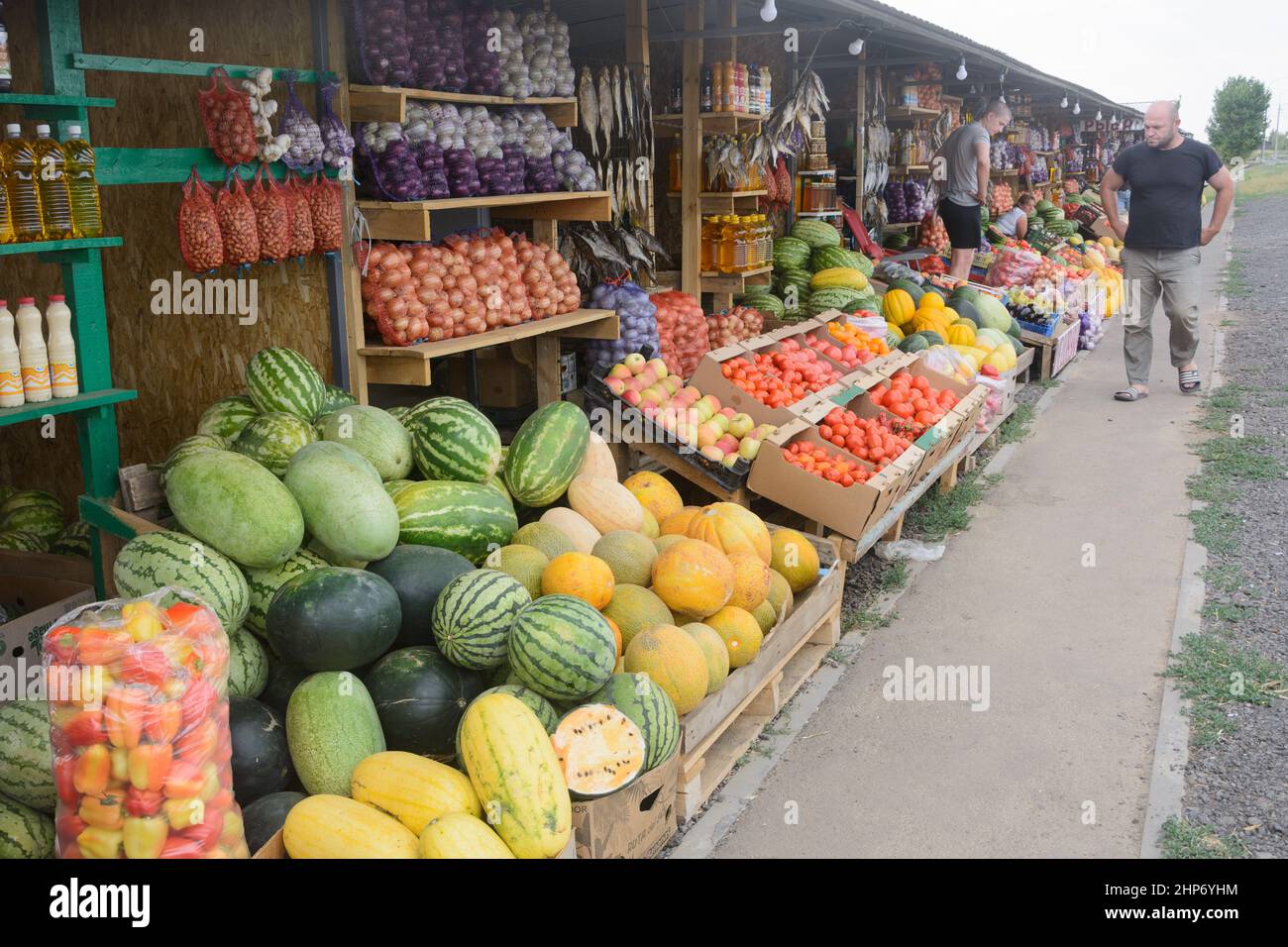 Volgograd, Russia - August 2021: Farmers market on road. Watermelons, tomatoes and vegetables. Environmentally friendly non-GMO products. Stock Photo